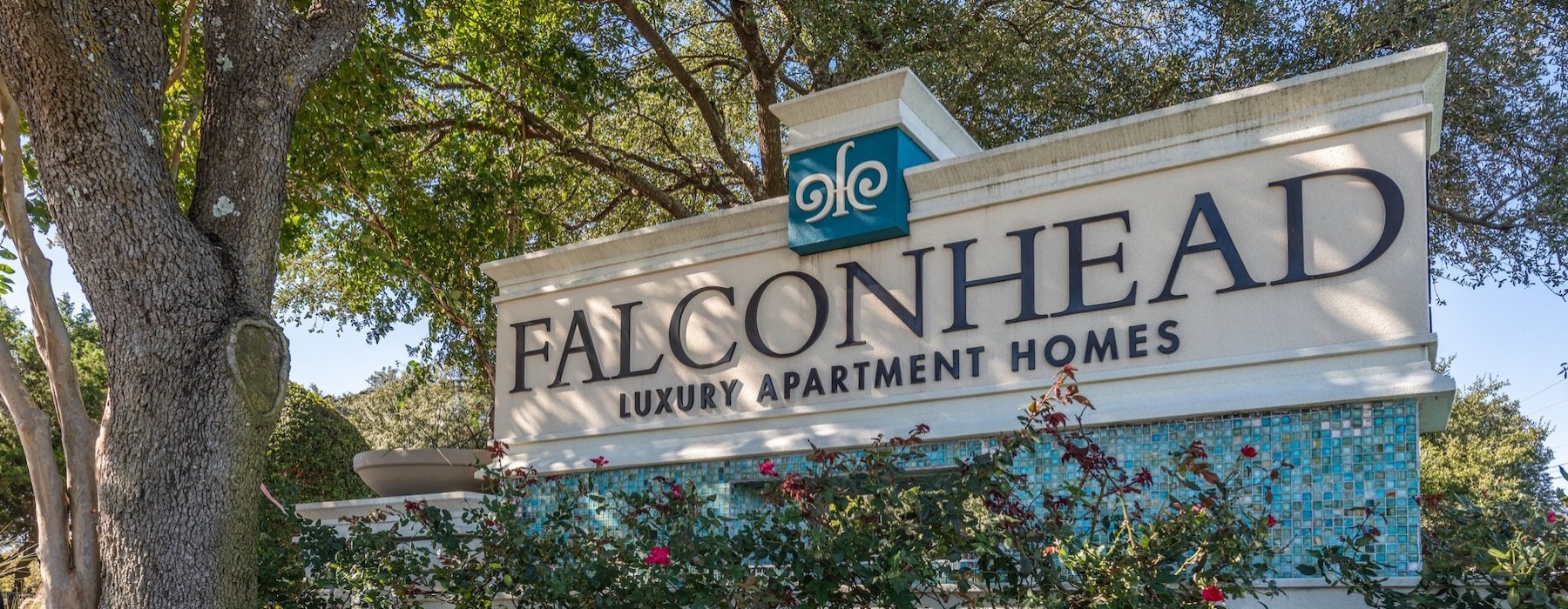 a large sign with trees