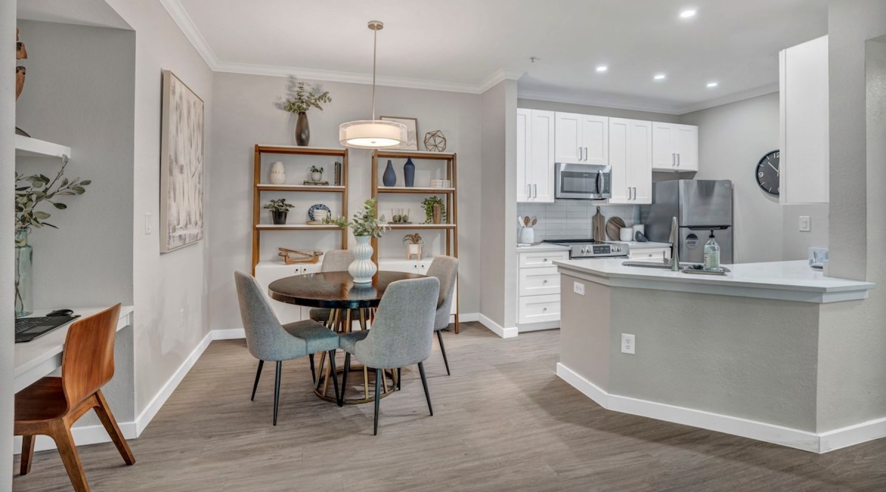 a kitchen with a dining table and chairs