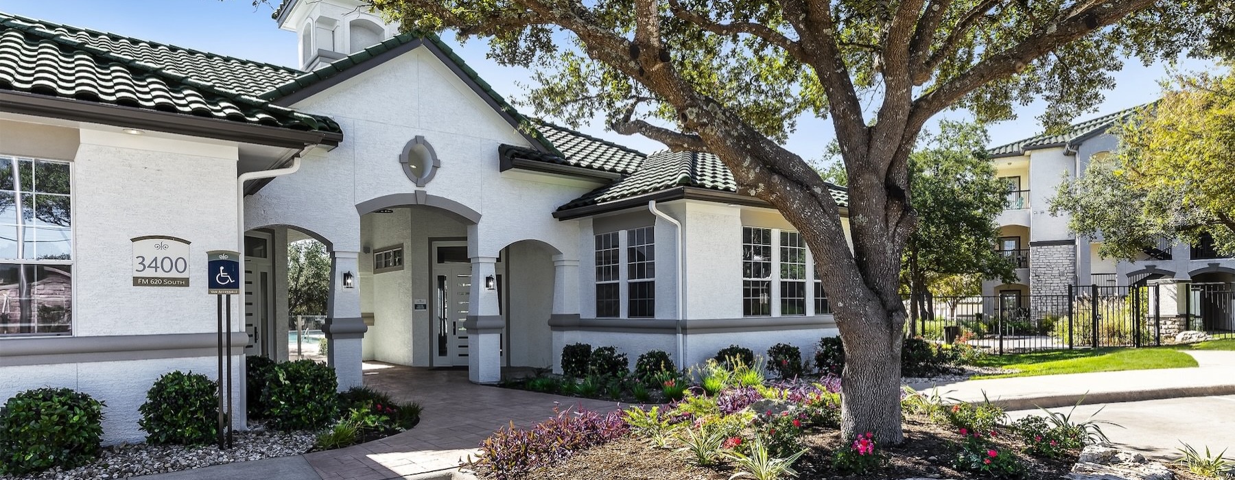 a building with a tree in front