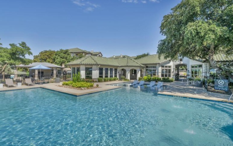 a pool in front of a building