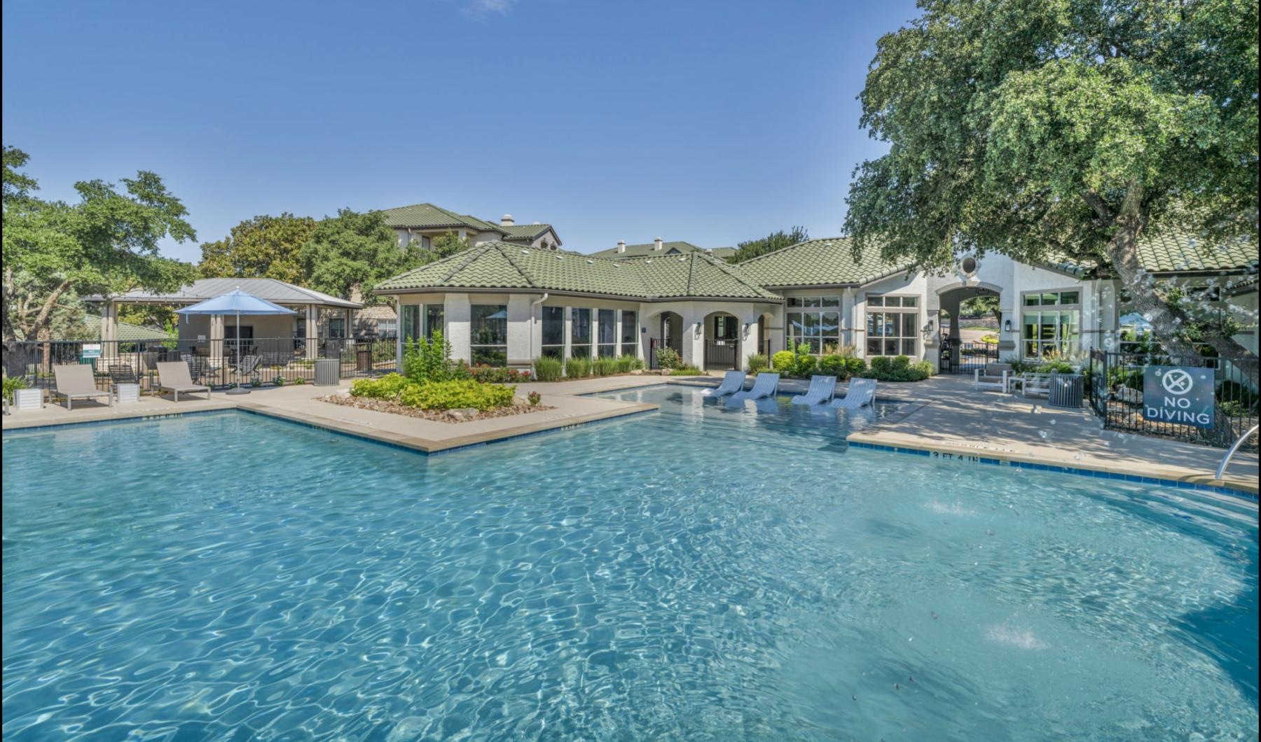 a pool in front of a building